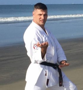 Martial Artist Practicing on the Beach